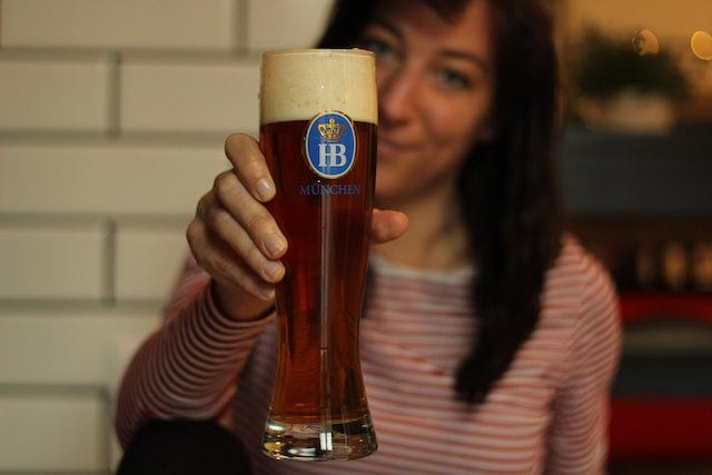 Happy person enjoying a cold drink