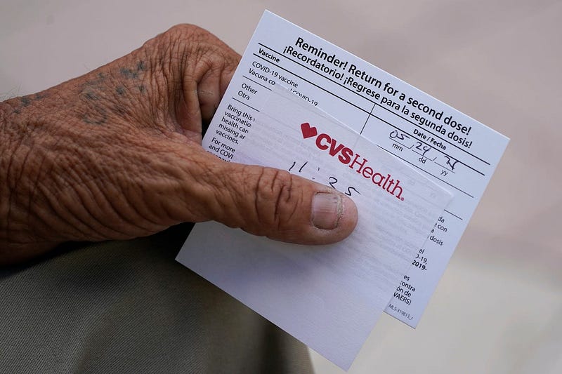 Individual showcasing vaccination card in Miami